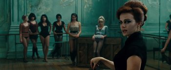 Movie still from “Sucker Punch” (2011), directed by Zack Snyder – A group of women standing in front of each other; Medium shot, Over the shoulder angle