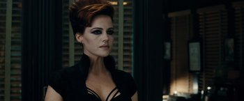 Movie still from “Sucker Punch” (2011), directed by Zack Snyder – A woman in a black top and a black jacket; Close Up shot, Over the shoulder angle