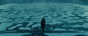 Movie still from “Sucker Punch” (2011), directed by Zack Snyder – A woman standing in the middle of an ice covered lake; Extreme Wide shot, High angle