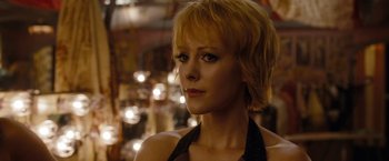 Movie still from “Sucker Punch” (2011), directed by Zack Snyder – A person with short blonde hair; Close Up shot, Over the shoulder angle