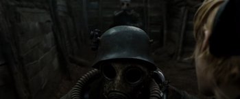 Movie still from “Sucker Punch” (2011), directed by Zack Snyder – A gas mask with a helmet on top of it; Close Up shot, Low angle