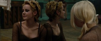 Movie still from “Sucker Punch” (2011), directed by Zack Snyder – Two women in fishnets are reflected in a mirror; Close Up shot, Over the shoulder angle