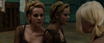 Movie still from “Sucker Punch” (2011), directed by Zack Snyder – Two young women are standing side by side; Close Up shot, High angle