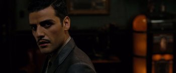 Movie still from “Sucker Punch” (2011), directed by Zack Snyder – A person wearing a suit and tie; Close Up shot, Over the shoulder angle