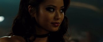 Movie still from “Sucker Punch” (2011), directed by Zack Snyder – A woman's face in a dark room; Close Up shot, Over the shoulder angle