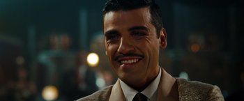 Movie still from “Sucker Punch” (2011), directed by Zack Snyder – A person wearing a suit and tie; Close Up shot, Low angle