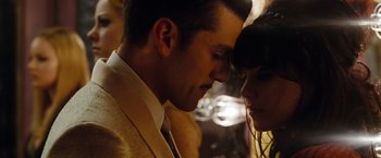 Movie still from “Sucker Punch” (2011), directed by Zack Snyder – A man and a woman looking into each others eyes; Close Up shot, Low angle