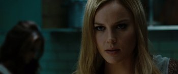 Movie still from “Sucker Punch” (2011), directed by Zack Snyder – A person with long blonde hair; Close Up shot, Over the shoulder angle