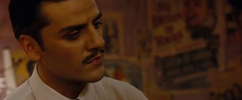 Movie still from “Sucker Punch” (2011), directed by Zack Snyder – A person wearing a suit and tie; Close Up shot, Low angle