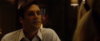 Movie still from “Sucker Punch” (2011), directed by Zack Snyder – A person wearing a shirt and tie; Close Up shot, Low angle