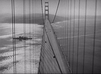 Movie still from “Sudden Fear” (1952), directed by David Miller – A black and white photo of a bridge and water; Extreme Wide shot, High angle