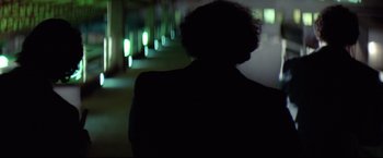 Movie still from “Sudden Impact” (1983), directed by Clint Eastwood – A blurry image of a person in a suit; Close Up shot, Over the shoulder angle