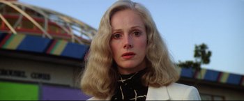 Movie still from “Sudden Impact” (1983), directed by Clint Eastwood – A person with long blonde hair; Close Up shot, Low angle