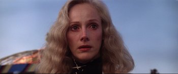 Movie still from “Sudden Impact” (1983), directed by Clint Eastwood – A person with long blonde hair; Close Up shot, Low angle