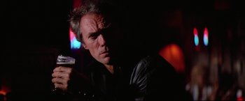 Movie still from “Sudden Impact” (1983), directed by Clint Eastwood – A person wearing a leather jacket; Close Up shot, Low angle