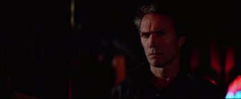Movie still from “Sudden Impact” (1983), directed by Clint Eastwood – A person wearing a black shirt; Close Up shot, Low angle