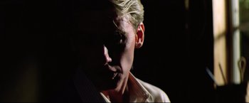 Movie still from “Sudden Impact” (1983), directed by Clint Eastwood – A person wearing a white dress shirt; Close Up shot, Low angle