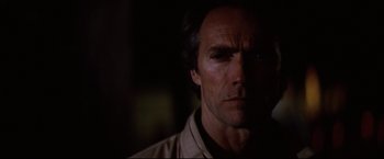 Movie still from “Sudden Impact” (1983), directed by Clint Eastwood – A person with a cigarette in his mouth; Close Up shot, Low angle