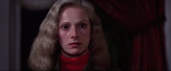 Movie still from “Sudden Impact” (1983), directed by Clint Eastwood – A person with long hair; Close Up shot, Over the shoulder angle