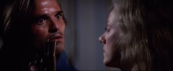 Movie still from “Sudden Impact” (1983), directed by Clint Eastwood – A man and a woman looking at each other in a room; Close Up shot, Over the shoulder angle