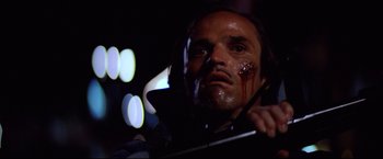 Movie still from “Sudden Impact” (1983), directed by Clint Eastwood – A man with blood all over his face; Close Up shot, Low angle