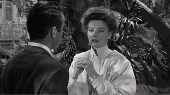 Movie still from “Suddenly, Last Summer” (1959), directed by Joseph L. Mankiewicz – An old photo of a man and a woman; Close Up shot, Over the shoulder angle