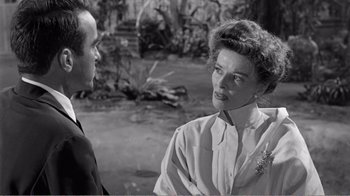 Movie still from “Suddenly, Last Summer” (1959), directed by Joseph L. Mankiewicz – A man and a woman talking to each other; Close Up shot, Over the shoulder angle