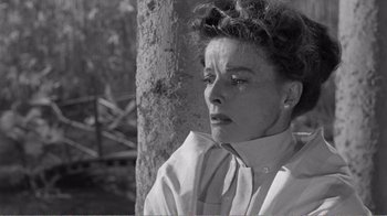 Movie still from “Suddenly, Last Summer” (1959), directed by Joseph L. Mankiewicz – An old photo of a woman looking sad; Close Up shot, Low angle