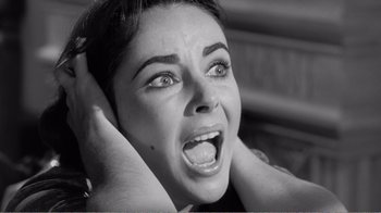 Movie still from “Suddenly, Last Summer” (1959), directed by Joseph L. Mankiewicz – A person with their hands on their head; Close Up shot, High angle