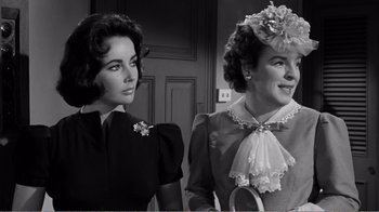 Movie still from “Suddenly, Last Summer” (1959), directed by Joseph L. Mankiewicz – Two beautiful women standing next to each other in a room; Close Up shot, Over the shoulder angle