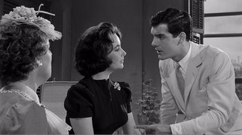 Movie still from “Suddenly, Last Summer” (1959), directed by Joseph L. Mankiewicz – A man and a woman talking to each other; Medium shot, Over the shoulder angle