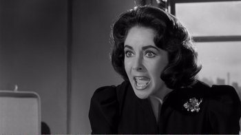 Movie still from “Suddenly, Last Summer” (1959), directed by Joseph L. Mankiewicz – An old photo of a woman making a funny face; Close Up shot, High angle