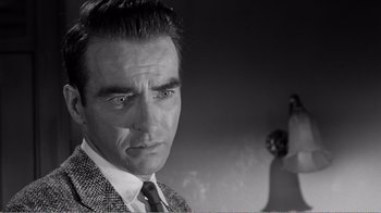 Movie still from “Suddenly, Last Summer” (1959), directed by Joseph L. Mankiewicz – Black and white photograph of a man in a suit; Close Up shot, Low angle