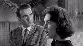 Movie still from “Suddenly, Last Summer” (1959), directed by Joseph L. Mankiewicz – An old photo of a man and a woman; Close Up shot, Over the shoulder angle