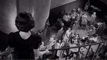 Movie still from “Suddenly, Last Summer” (1959), directed by Joseph L. Mankiewicz – A group of people standing in a room; Extreme Wide shot, High angle