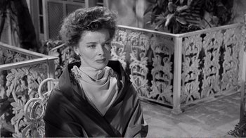 Movie still from “Suddenly, Last Summer” (1959), directed by Joseph L. Mankiewicz – An old photo of an older woman in a black and white photo; Close Up shot, Over the shoulder angle