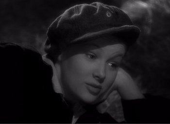 Movie still from “Sullivan's Travels” (1941), directed by Preston Sturges – A black and white photo of a woman with a hat; Close Up shot, High angle
