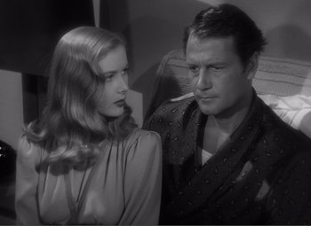 Movie still from “Sullivan's Travels” (1941), directed by Preston Sturges – A man and a woman are looking at one another; Close Up shot, High angle