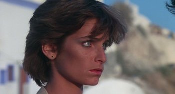 Movie still from “Summer Lovers” (1982), directed by Randal Kleiser – A woman's face with a piercing; Close Up shot, Low angle