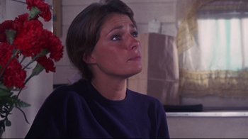 Movie still from “Summer of '42” (1971), directed by Robert Mulligan – A person sitting in a room; Close Up shot, Over the shoulder angle