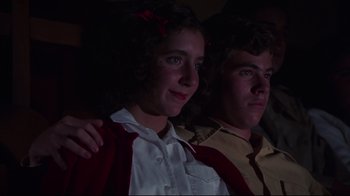 Movie still from “Summer of '42” (1971), directed by Robert Mulligan – A girl and a boy sitting next to each other in the dark; Close Up shot, Low angle
