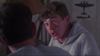 Movie still from “Summer of '42” (1971), directed by Robert Mulligan – A young man looking at another young man in a room; Close Up shot, Over the shoulder angle