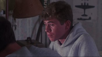 Movie still from “Summer of '42” (1971), directed by Robert Mulligan – A young man is looking at a computer screen; Close Up shot, Over the shoulder angle