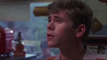 Movie still from “Summer of '42” (1971), directed by Robert Mulligan – A young man looking up into the air; Close Up shot, Low angle