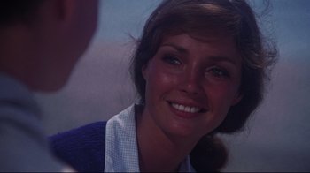 Movie still from “Summer of '42” (1971), directed by Robert Mulligan – A woman smiling for the camera; Close Up shot, Over the shoulder angle