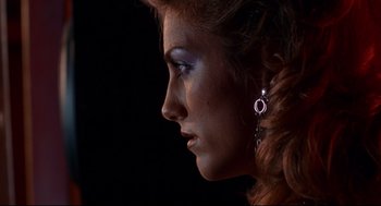 Movie still from “Summer of Sam” (1999), directed by Spike Lee – A person wearing a earring; Close Up shot, Low angle