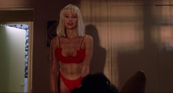 Movie still from “Summer of Sam” (1999), directed by Spike Lee – A woman in a red bra and panties; Medium shot, Low angle