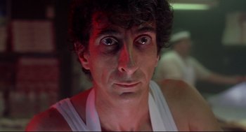 Movie still from “Summer of Sam” (1999), directed by Spike Lee – A person wearing a white shirt; Close Up shot, Low angle