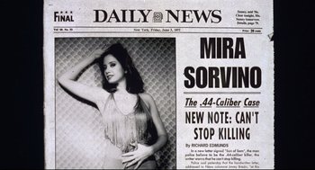 Movie still from “Summer of Sam” (1999), directed by Spike Lee – A newspaper with a picture of a woman on the front page; Extreme Close Up shot, Low angle