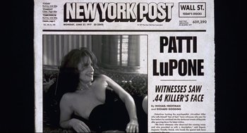 Movie still from “Summer of Sam” (1999), directed by Spike Lee – A black and white photo of a woman sitting on a couch; Extreme Close Up shot, Low angle